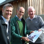 Phil Davies (C), Founding Director of Community Energy Cumbria shows the Share Offer Document to Clive Wickham (L), Partnerships Manager at LDNP and Dave Townley (R), Site Mgr for Ellergreen Hydro.